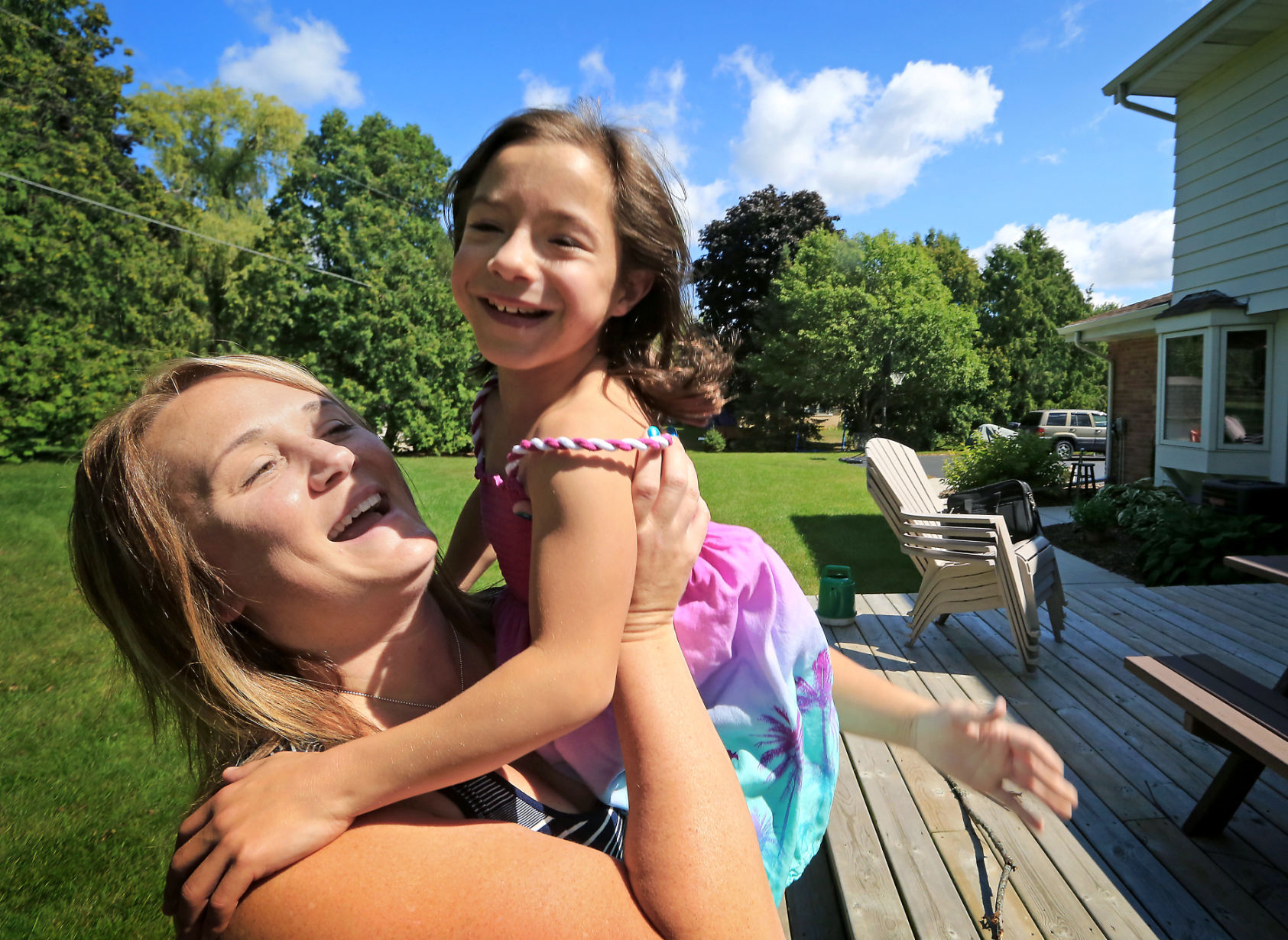 Kelly and Mira smiling